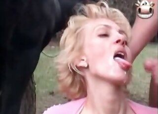 Blonde sucking tasty horse cock outdoors