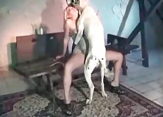 Blonde gets doggy-style banged by a dog
