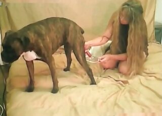 Horned-up blondie gets to fuck a kinky dog