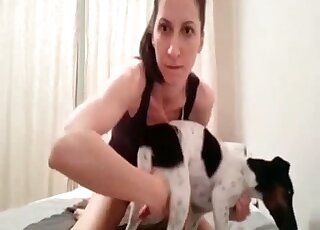 Ponytailed brunette wants that dog cock inside