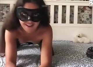 Brunette in a mask gets violated by a dog cock