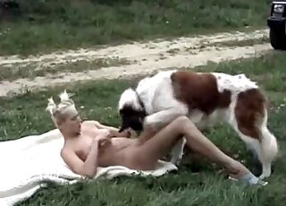 Blonde with a cool hairdo fucked outdoors by a dog