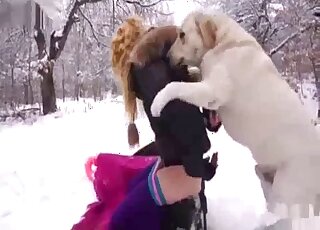 Blondie seducing her dog outdoors, in the winter