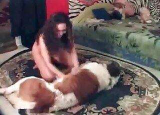 Nude dark-haired slut seducing a dog
