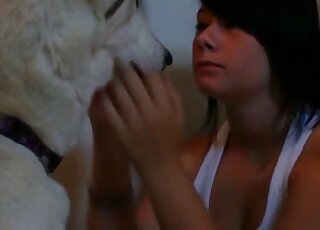 Black-haired chick likes her trained doggy so much